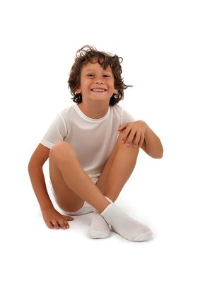 Kid wearing DermaSilk Child Undersocks